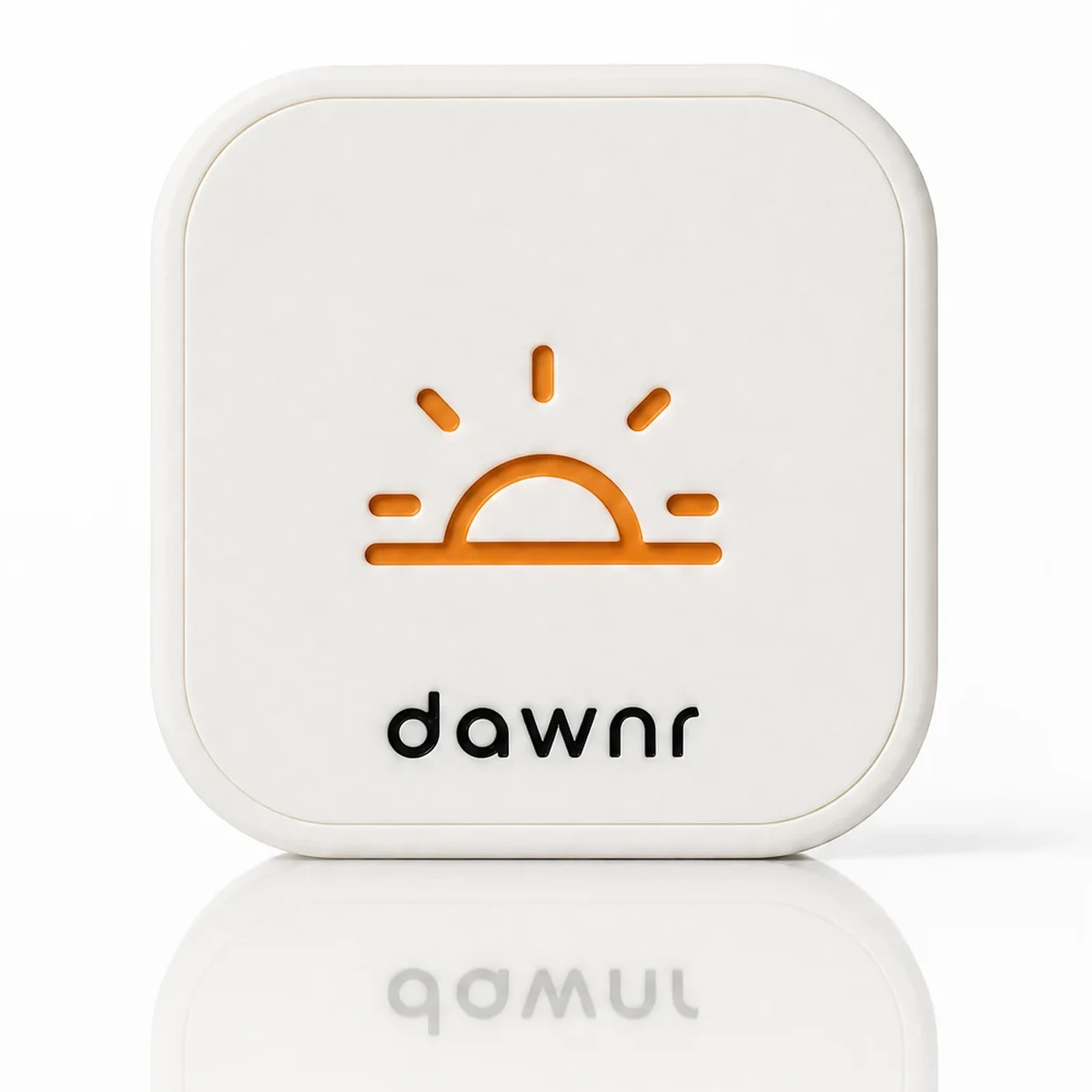 the dawnr, a soft-white rounded tile with the rising-sun mark, head-on on a white studio ground with its reflection